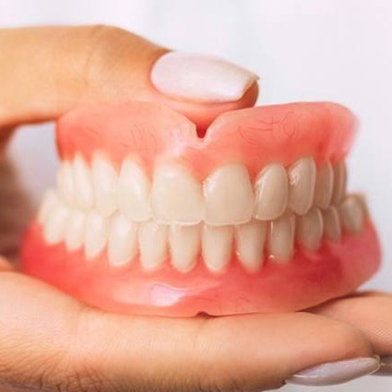 Complete set of natural-looking dentures handcrafted at Grimsby Denture Clinic